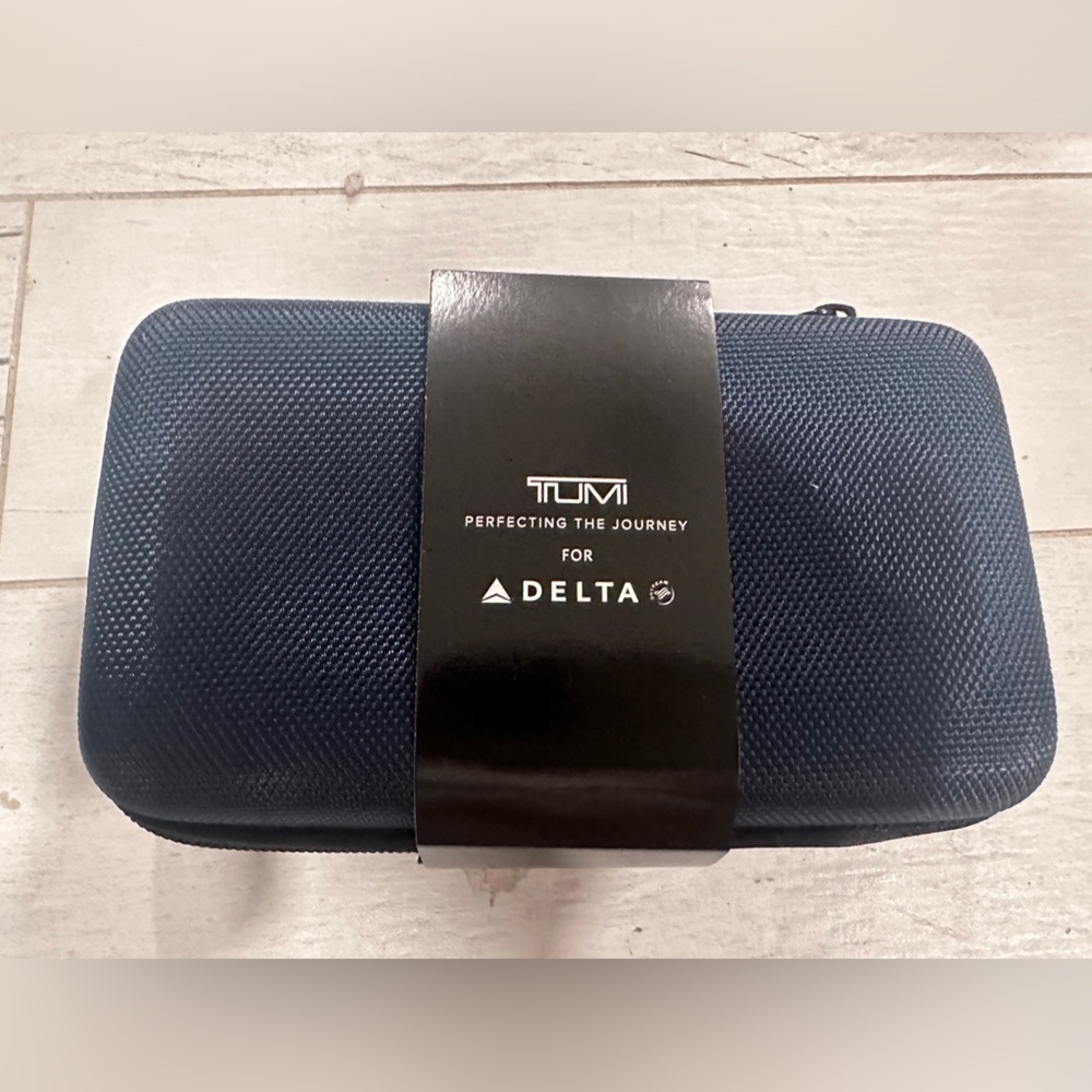 New TUMI Travel  case sealed .
